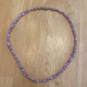 Purple beaded style necklace about 16 in. Screw closure.